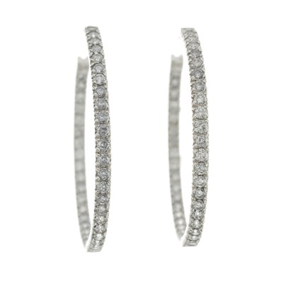 Lot 129 - A pair of brilliant-cut diamond hoop earrings