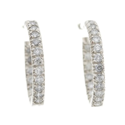 Lot 138 - A pair of brilliant-cut diamond hoop earrings