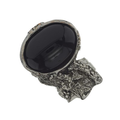 Lot 411 - Yves Saint Laurent, a black paste abstract ring.