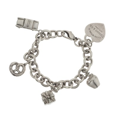 Lot 417 - Tiffany & Co., a charm bracelet.