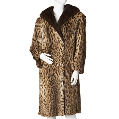 Lot 453 - Mortons, an ocelot fur coat with mink fur trim.