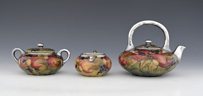 Lot 21 - 'Pomegranate' a rare Moorcroft Pottery three...