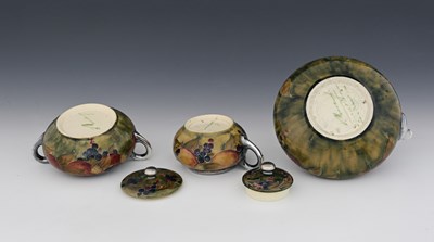Lot 21 - 'Pomegranate' a rare Moorcroft Pottery three...