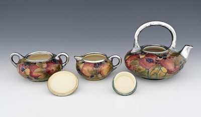 Lot 21 - 'Pomegranate' a rare Moorcroft Pottery three...