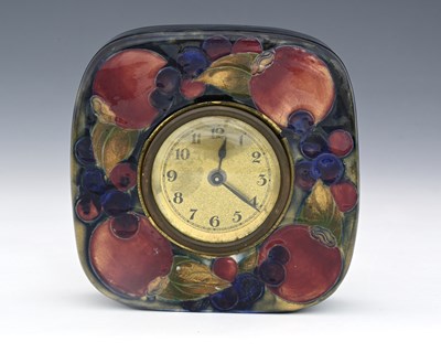 Lot 19 - 'Pomegranate' a Moorcroft Pottery mantel clock...