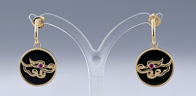 Lot 447 - A pair of onyx and ruby drop earrings