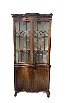 Lot 623 - A reproduction mahogany corner cupboard, in...