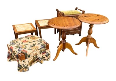 Lot 619 - A pair of pine tripod tables with round tops,...