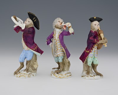 Lot 606 - Meissen, a group of three Monkey Band figures,...