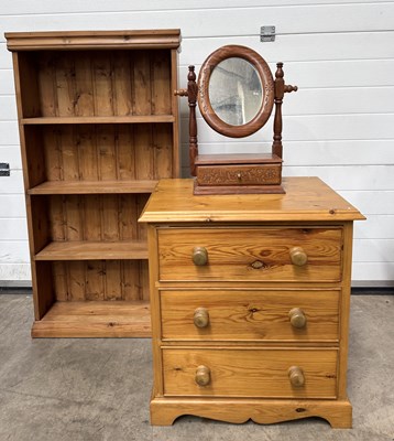 Lot 629 - A slim pine bookcase, four shelves, pannelled...