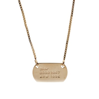 Lot 300 - Christian Dior, a New Look 1947 dog tag...