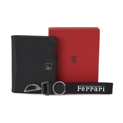Lot 296 - Ferrari, a passport wallet and a keyring.