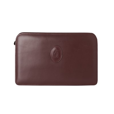 Lot 252 - Cartier, a vintage Bordeaux leather clutch.