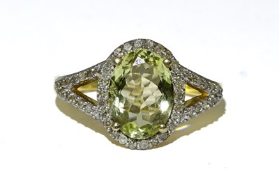 Lot 429 - A silver gilt oval green beryl and single-cut diamond cluster ring