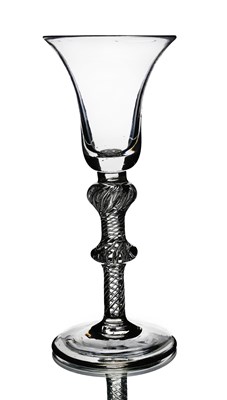 Lot 565 - A double knopped airtwist wine glass, circa...
