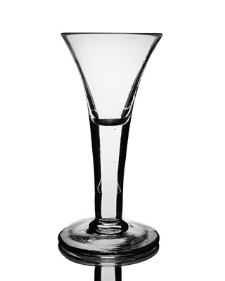 Lot 562 - A heavy drawn trumpet wine glass, circa 1740,...
