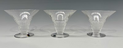 Lot 144 - Three Lalique Bourgueil champagne glasses,...