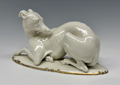 Lot 88 - A Rosenthal model of a recumbent greyhound or...