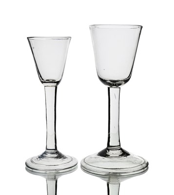 Lot 567 - Two plain stemmed wine glasses, circa 1740,...