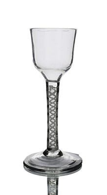 Lot 568 - An opaque twist wine glass, circa 1760, the...