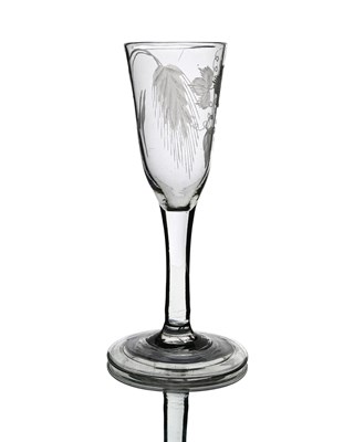 Lot 563 - An engraved glass ale flute, circa 1740, the...