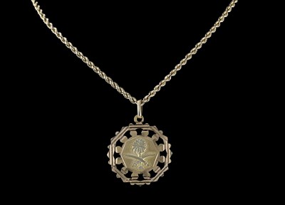 Lot 451 - A palm tree and sword pendant and chain