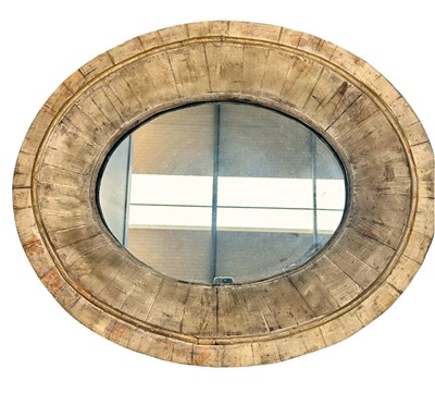 Lot 645 - A contemporary oval wall mirror, radiating...