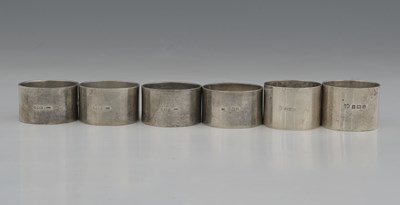 Lot 213 - A set of four hallmarked silver napkin rings,...