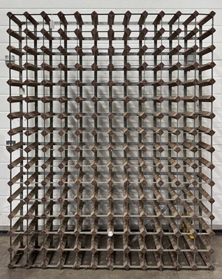 Lot 641 - A large pine and zinc wine rack, 120 by 148cm