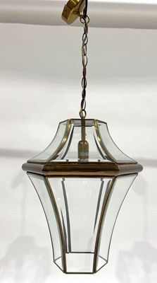 Lot 566 - A contemporary pendant glass and brass hall...