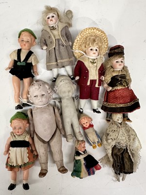 Lot 174 - A small collection of Bisque dolls to include,...
