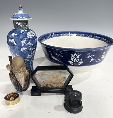 Lot 75 - A small lidded prunus pattern blue and white...