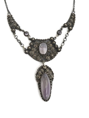 Lot 547 - A Liberty & Co silver and amethyst pendant...