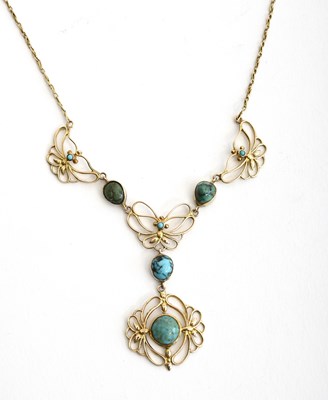Lot 565 - A Liberty & Co gold and turquoise Butterfly...