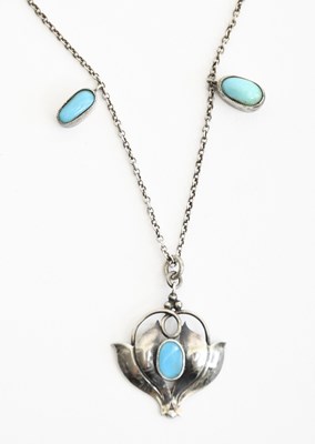 Lot 571 - A silver and turquoise pendant necklace in the...