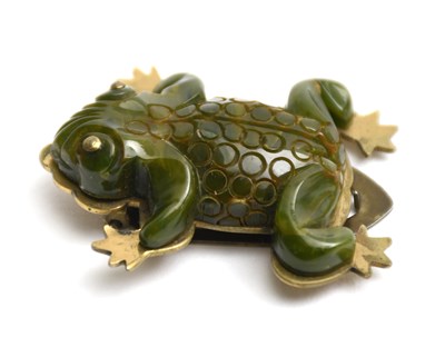 Lot 34 - A green bakelite frog dress clip brooch,...
