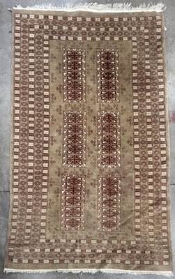 Lot 575 - A Turkmen-style wool rug, neutral colour...