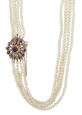 Lot 46 - A graduated five strand cultured pearl necklace with amethyst and split pearl clasp