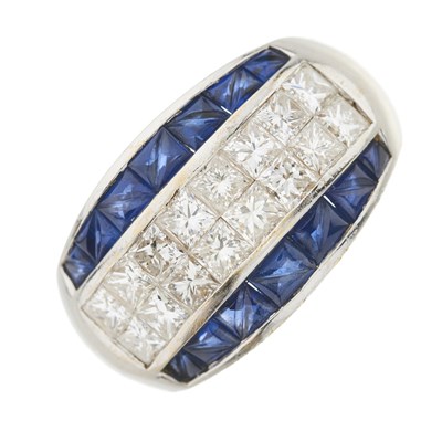 Lot 53 - A princess-cut diamond and fancy-cut sapphire dress ring