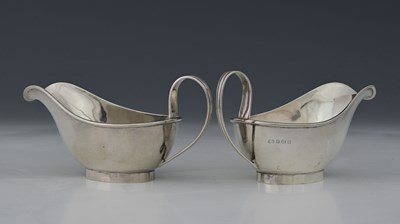 Lot 231 - A pair of George V silver sauce boats, by...