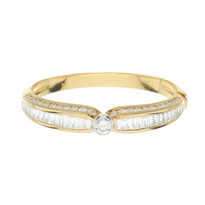 Lot 174 - A brilliant-cut and baguette-cut diamond bangle