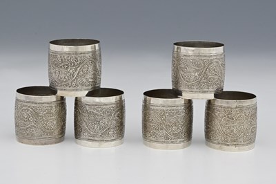 Lot 179 - A set of six silver-coloured metal napkin...
