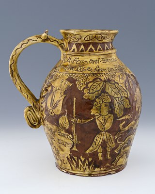 Lot 649 - An English slipware jug, sgraffito decorated...