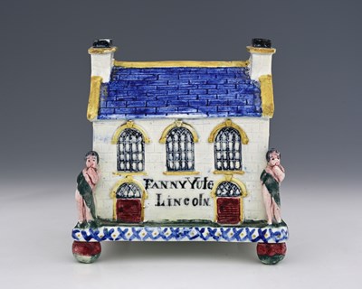 Lot 654 - A Mexborough Prattware Pottery money box,...