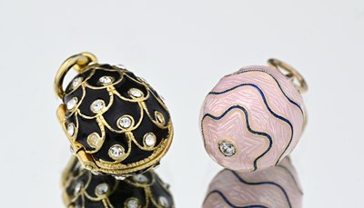 Lot 437 - Two enamel and gem egg pendants