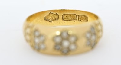 Lot 430 - A Victorian 18ct gold rose-cut diamond floral band ring