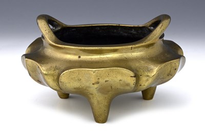 Lot 122 - A Chinese bronze censer, with arched handles,...