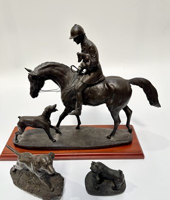 Lot 76 - A model of a huntsman mounted on a horse...