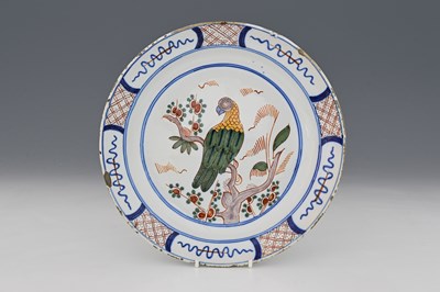 Lot 610 - A Delft polychrome plate, 18th century,...