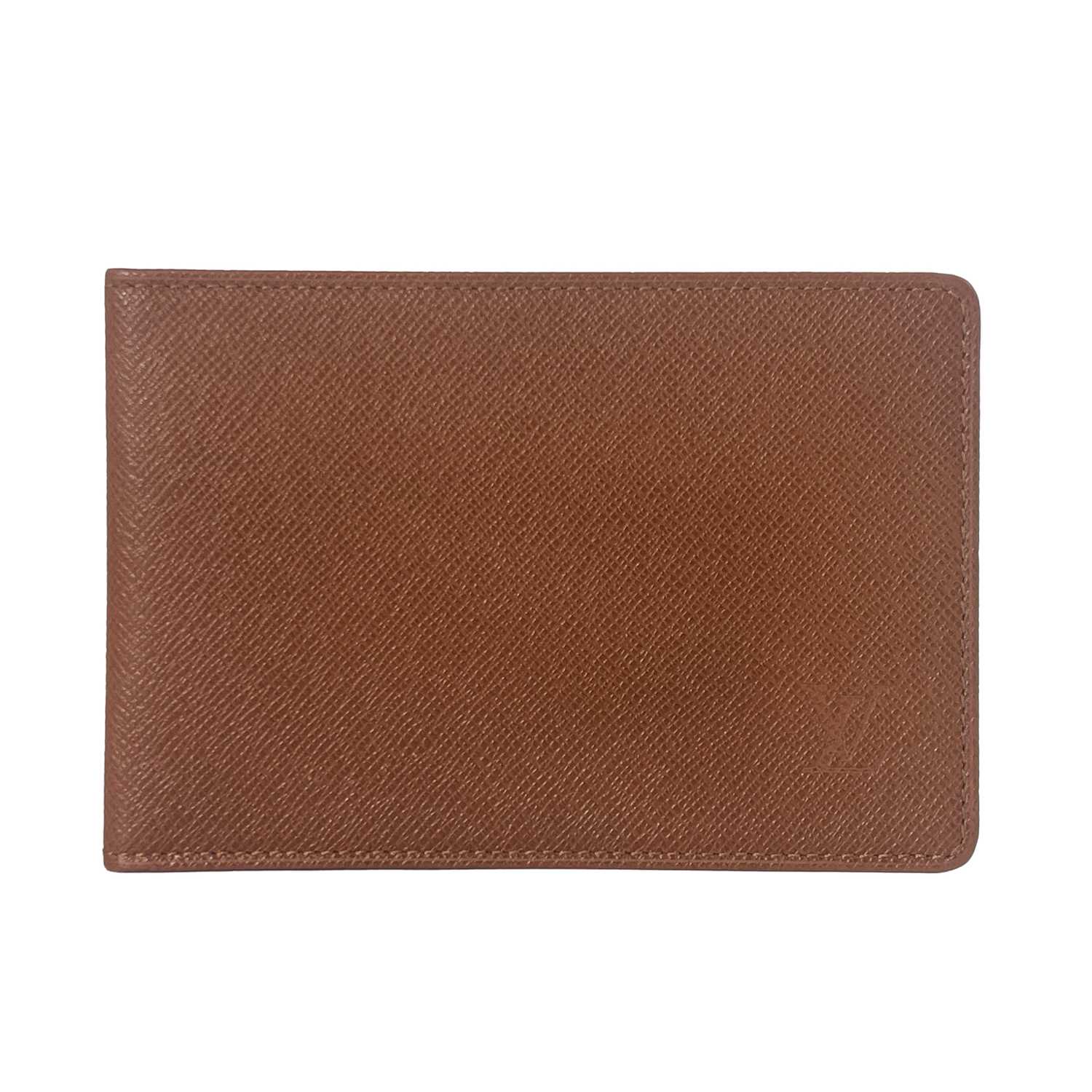 Lot 424 - Louis Vuitton, a Taiga card wallet, crafted...